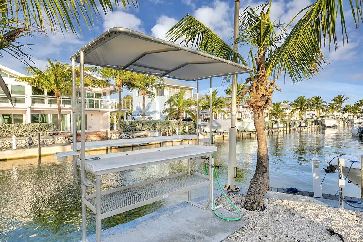 Boat lifts and docks along the Kawama marina, ocean access for guests in Key Largo