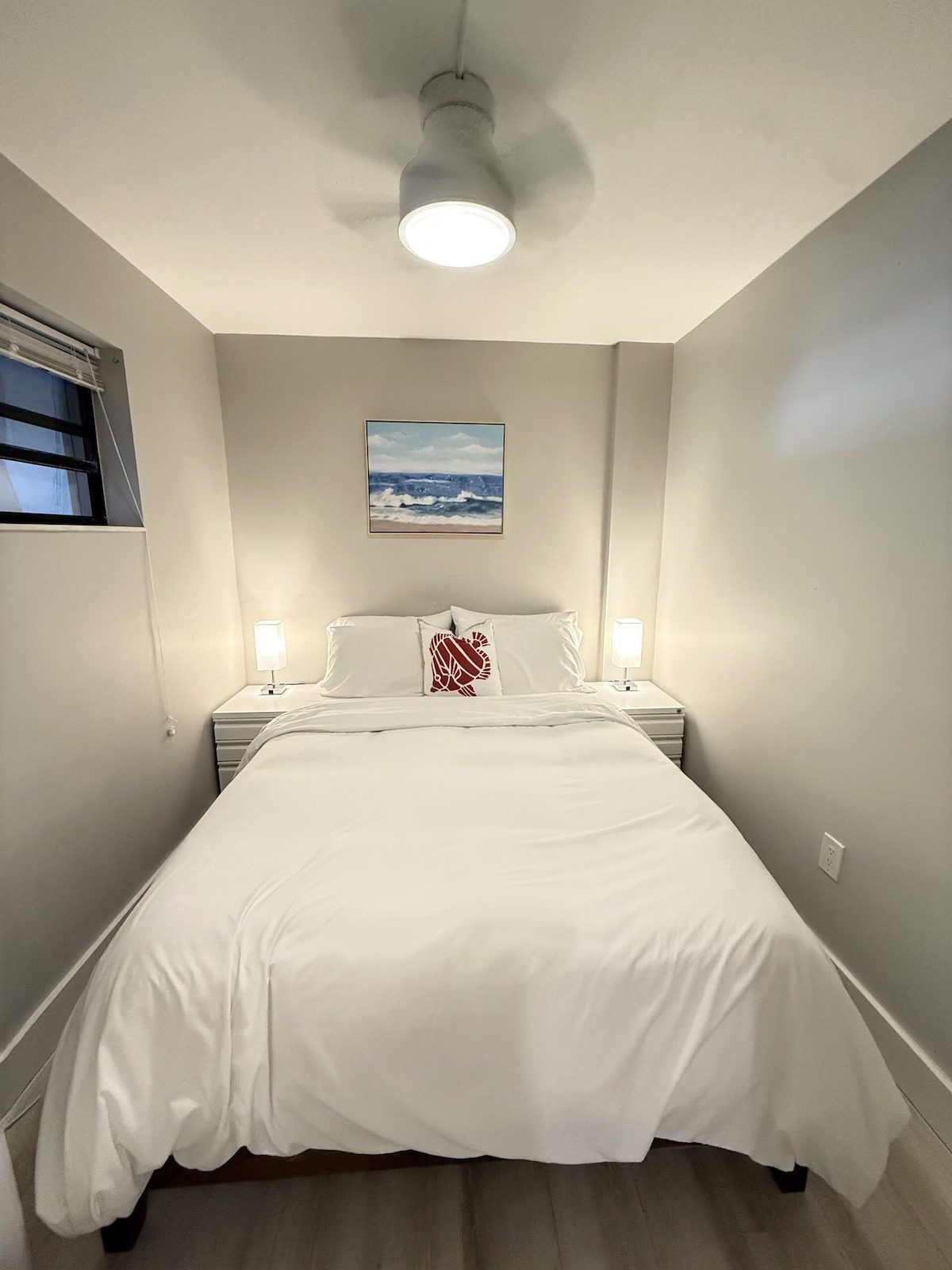 Fourth bedroom with white bedding in this pet friendly Key Largo vacation home