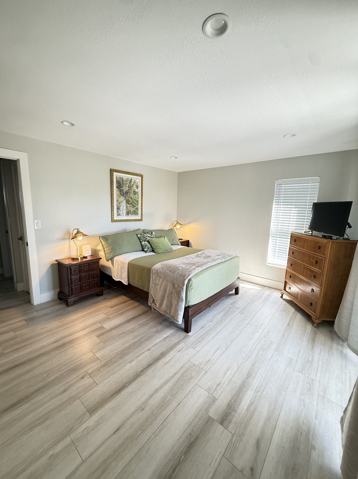 Third bedroom with television and dresser in the Kawama Yacht Club townhome